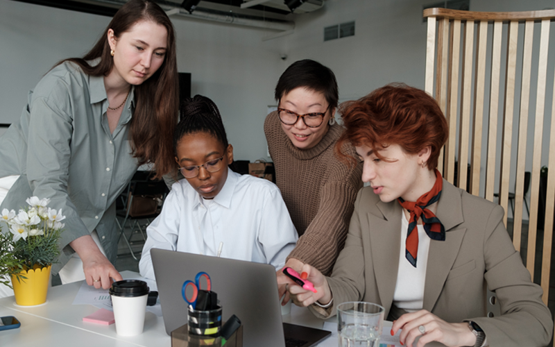 Business team looking at computer screen