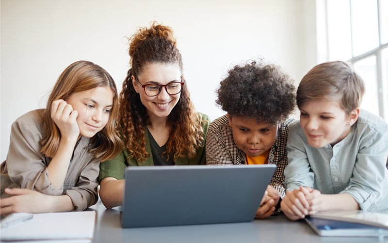 Student Engagement Image: Illustration featuring students attentively using a computer