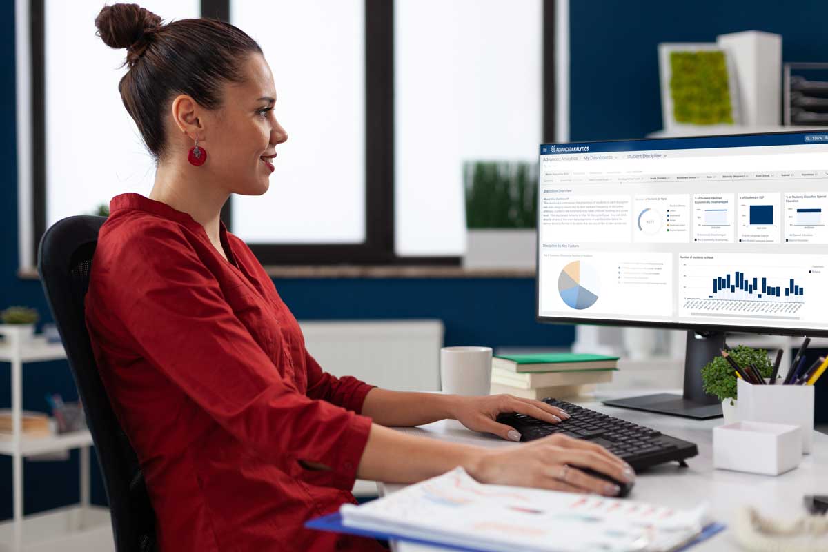 School Administrator looking at Mindex Advanced Analytics Dashboard