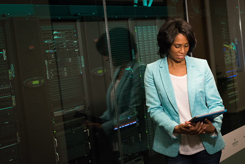 woman standing by data center